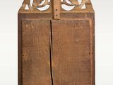 an old wooden cabinet with a bird design on it