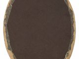 an overhead view of a round wooden table top with a brown surface