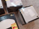 several boxes of electronic devices sitting on the floor next to each other
