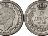 a silver coin with a crown on top of it