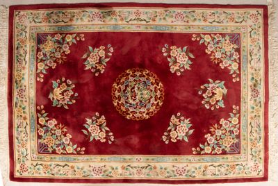 an image of a red rug with a floral design on it