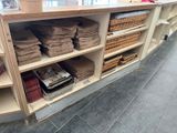 a counter with a lot of paper and baskets on it