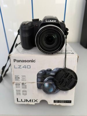 a camera sitting on top of a box on a table