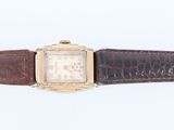 an image of a wrist watch with a brown leather band