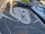 several jet skis are lined up on the side of the road