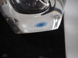 a close up of a glass of water on a black surface