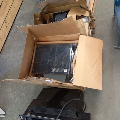 several boxes of electronic equipment are stacked on top of each other