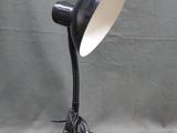 a black lamp that is sitting on a table