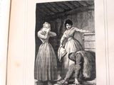 un vieux livre sur lequel figure l'image d'une femme et d'un homme