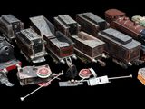 many different types of toy trains on a black background