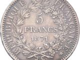 a close up of a coin with a wreath on it