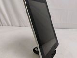 a tablet that is sitting on a stand on the table