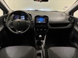 the interior of a small car with a steering wheel and dashboard