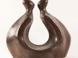 bronze sculpture of a pair of birds on a white background