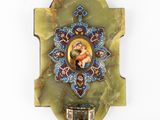an image of a wall hanging with a picture of a woman on it