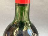 a bottle of wine that is sitting on a table