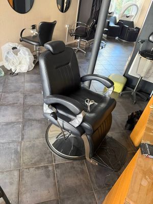 a barber chair in the middle of the room