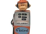 a figurine of a gas pump with a sign on top