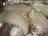 a glass display case with a bunch of vases in it