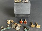 a close up of a box with a bunch of different types of cuff watches
