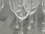 several empty wine glasses are lined up on a table