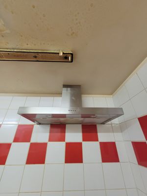 a red and white checkered floor in a bathroom
