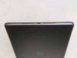 an apple ipad is sitting on top of a white table