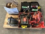 a box of tools sitting on a pallet on the ground