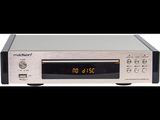 an image of a silver cd player with a clock on it