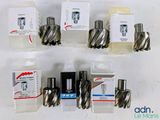 many different types of drill bits in a display case