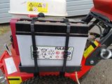 a red and black motorcycle with a cooler on the back