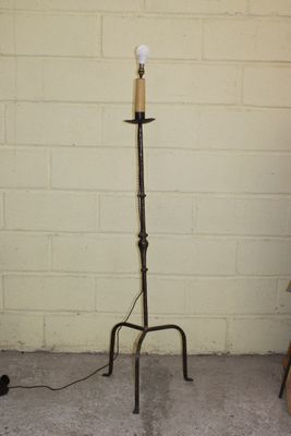 a lamp that is on a stand in a room