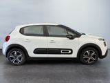 the white citrole is parked on the concrete floor