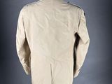 the back of a beige jacket on a mannequin mannequin mannequin mannequin mannequin mannequin mannequin mannequin