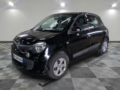 a picture of a small black car on a checkered floor