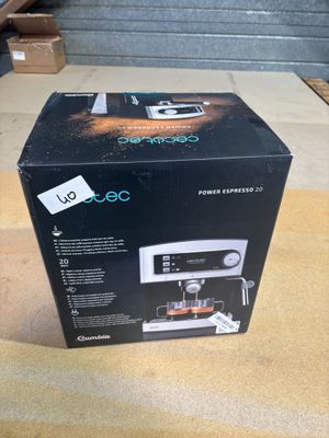 boxed box of a coffee machine sitting on a table in a room