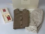 an image of a baby boy ' s outfit and diaper set with a box
