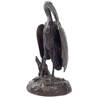 a statue of a bird that is sitting on top of a rock