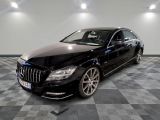 a picture of a black mercedes s - class parked on a checkered floor