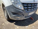 a white van with a broken front bumper and a broken front bumper