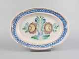 a plate with a design on it on a stand