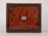 a small wooden box with a black and brown border