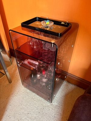 a glass table with a tray on top of it