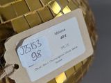 a gold disco ball with a price tag on it