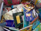 a box full of children ' s books sitting on the floor