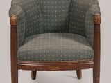 an image of a chair with a wooden frame and upholstered upholstered seat