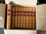 a lot of books in a box on the floor