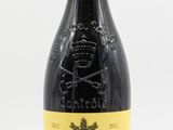 a bottle of wine that is sitting on a table