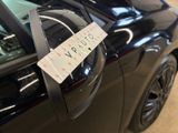 a sticker on the door handle of a car