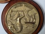 two medallions on the wall of a room